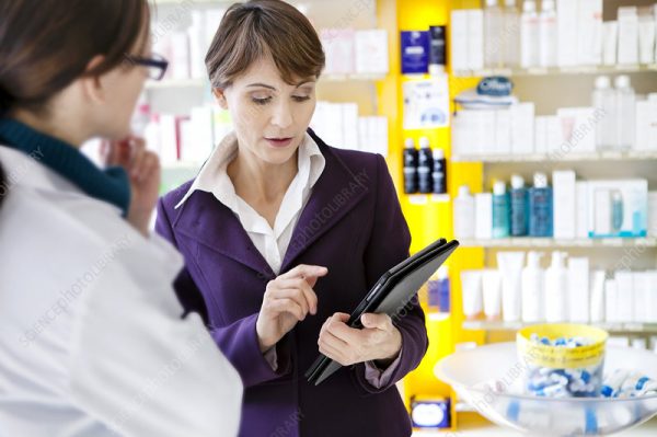 Medical representative with a pharmacist.